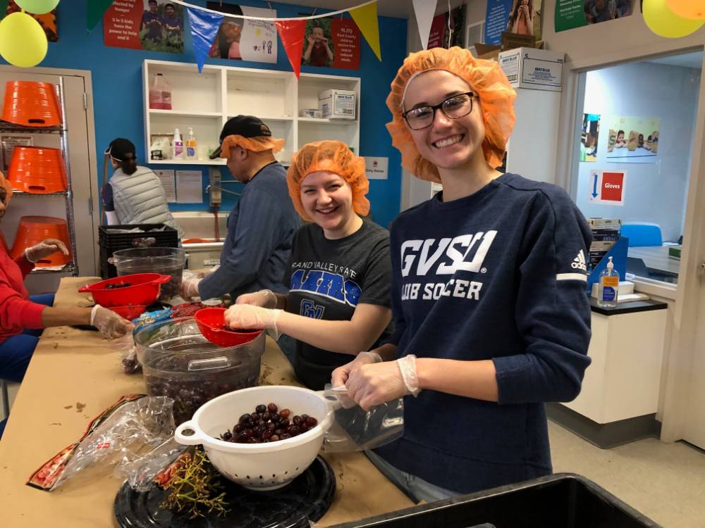 Laker volunteers at Kids' Food Basket